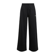 Pantaloni Adidas a gamba larga in tessuto felpato